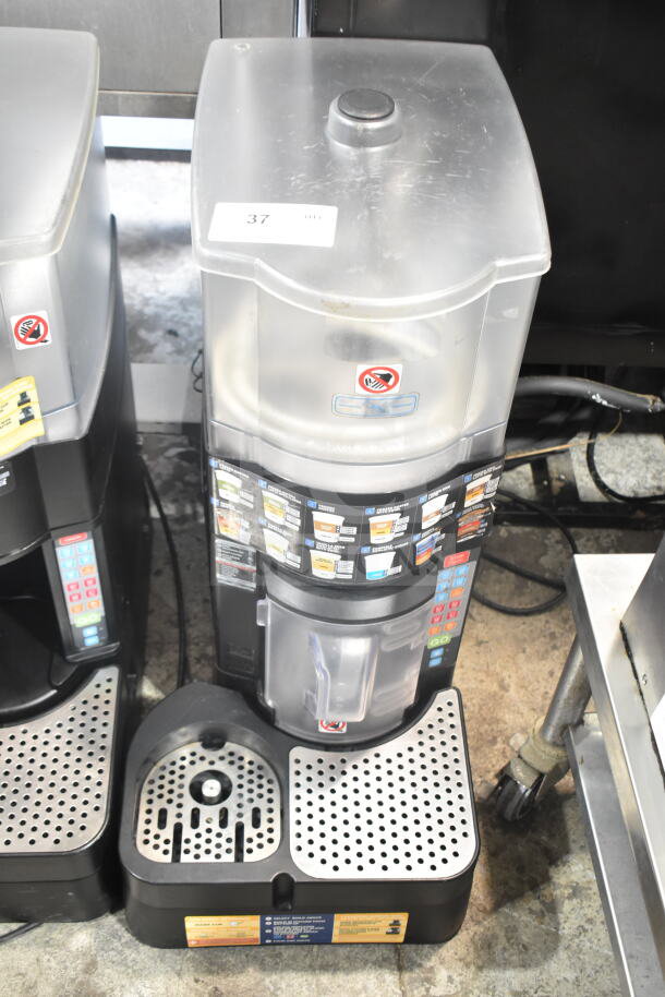Taylor X83684-12 commercial countertop frozen beverage machine in used condition, detailed controls and dispensing area visible.