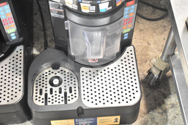 Taylor X83684-12 commercial countertop frozen beverage drink mixer, featuring digital controls and stainless steel drip trays.