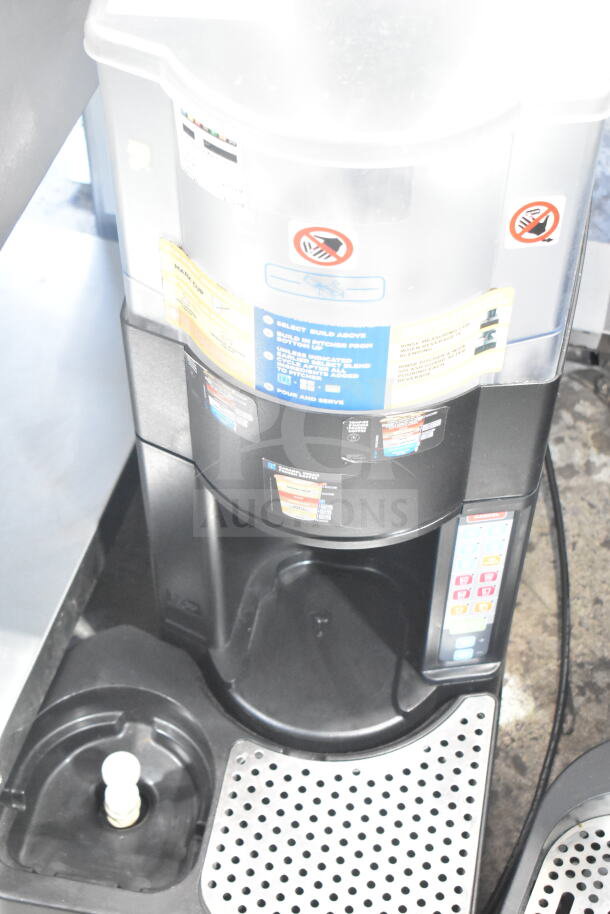 Taylor X81173-12 commercial countertop frozen beverage machine with control panel and safety warnings visible.