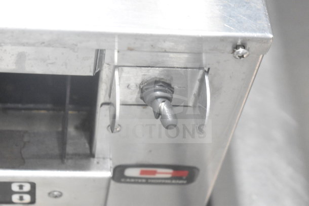 Carter Hoffmann M343S-DD holding bin detail, showing a metal control knob and logo on stainless steel exterior.