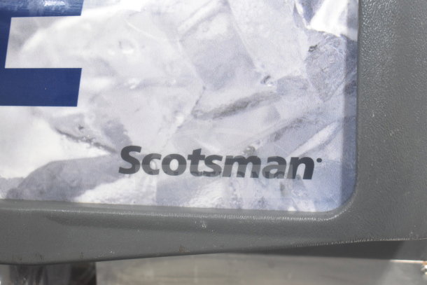 2019 Scotsman C0530MA-1E Ice Head logo on Scotsman ID200B-1A Commercial Ice Dispenser, displaying ice background.