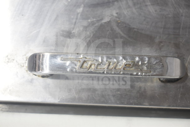 True TSSU-27-12M-B commercial prep table handle with brand logo. Stainless steel finish, slight wear visible.