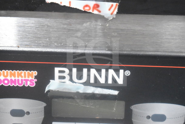 Bunn MHG commercial countertop coffee grinder, 2 hoppers, no lids, 120 volts, visible brand label; used condition.
