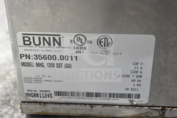Bunn MHG coffee bean grinder label showing model, 120V, 1 phase, UL and ETL listed, no lids included.