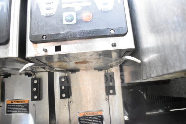 Bunn MHG commercial coffee grinder, dual hopper, no lids. Features BrewWISE technology. 120V, 1-phase, visible wear.