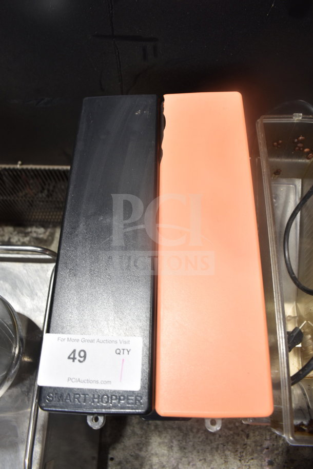 Bunn MHG commercial coffee grinder with two hoppers, black and orange covers, visible tag "49" reads "Smart Hopper," 120V, 1 Phase.