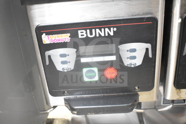 Bunn MHG Commercial Coffee Grinder, 2 hoppers, 120V, with visible control panel. Dunkin' Donuts logo on display.
