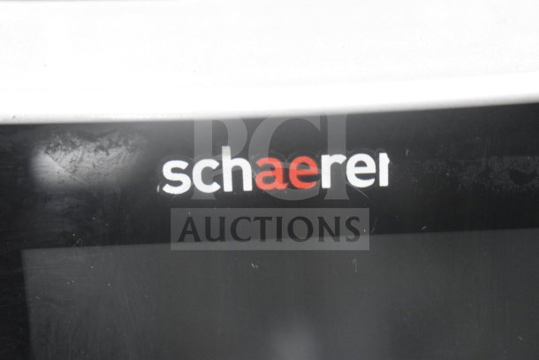 Schaerer Coffee Art Espresso Machine, black surface, visible logo. Slight wear. Perfect for café or home use.