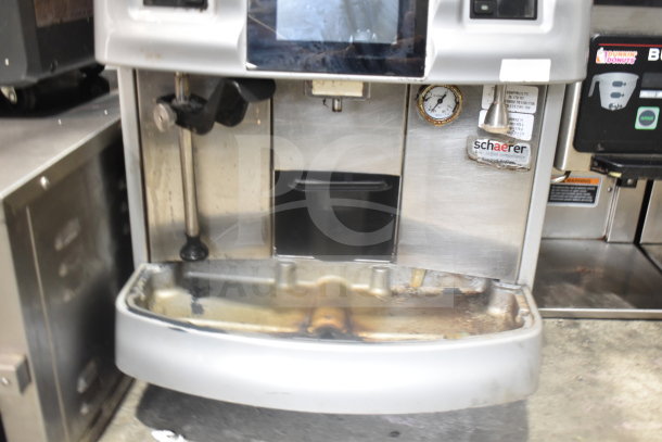 Schaerer Coffee Art Espresso Machine, stainless steel body, used condition, visible Schaerer label, pressure gauge, and drip tray.