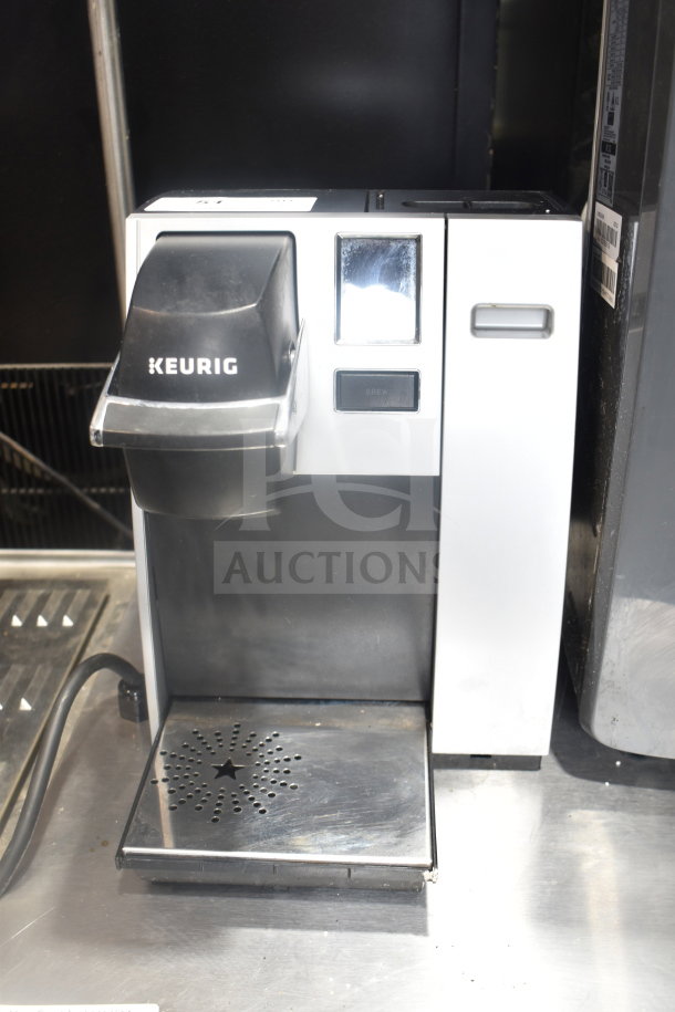 Keurig K150 coffee machine, single cup, countertop model, 120 volts, black and white finish, with drip tray.