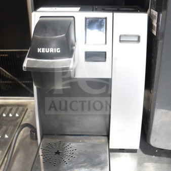 Keurig K150 coffee machine, single cup, countertop model, 120 volts, black and white finish, with drip tray.