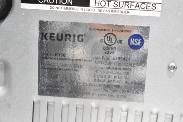 Keurig K150 Coffee Machine label showing model, 120V, 1400W, UL and NSF listed markings.
