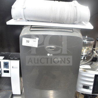 LG LP0823GSSM portable air conditioner, 115V, in good condition with exhaust hose on top. Auction label "52" visible.