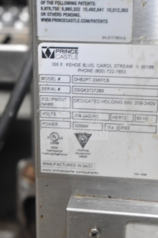 Prince Castle DHB2PT-33KFCB Commercial Holding Bin label; 208-240V, 3200W, model and serial details visible.