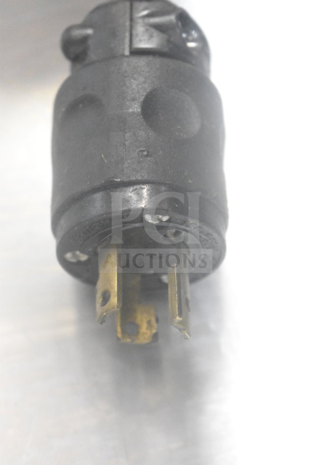 Power plug of an AJ Antunes Commercial Countertop Bun Toaster. Three-pronged plug, in used condition.