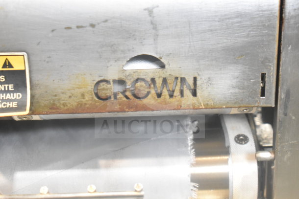 AJ Antunes Commercial Countertop Bun Toaster, metallic finish, visible wear, "CROWN" marking, safety label on side.