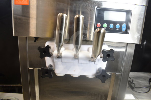 Vevor BOL-7220T soft serve ice cream machine with 2 flavors and twist option, stainless steel, on equipment stand, excellent condition.