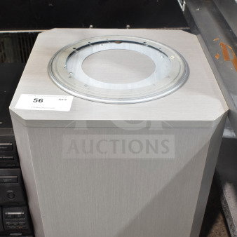 Speaker on casters, unfinished top, gray wood finish. Auction tag "56" visible on the corner. Good condition.