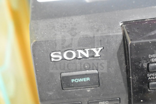 Sony CD player with visible logo and power button, showing slight wear and dust on the surface.