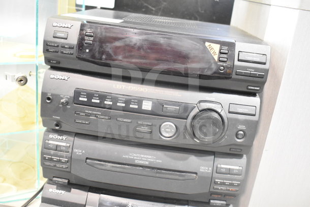 Sony CD player model LBT-D590, multiple controls, slight wear, "new" sticker visible, ideal for collectors.