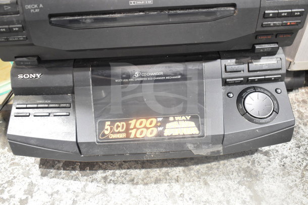 Sony CD player with 5-disc changer, multi jog dial, and 3-way super woofer speakers. Visible wear on surface.