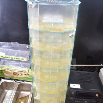 Timex display rack with glass shelves and hexagonal holders, featuring brand logo on top. Good condition.