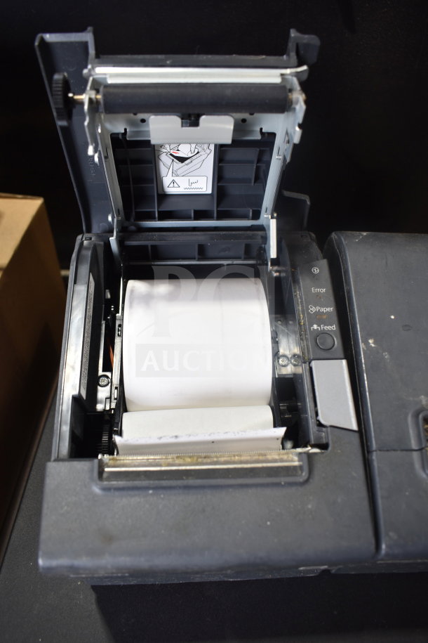 7 items including 4 cash drawers and 3 Epson receipt printers, open view showing paper roll, used condition.