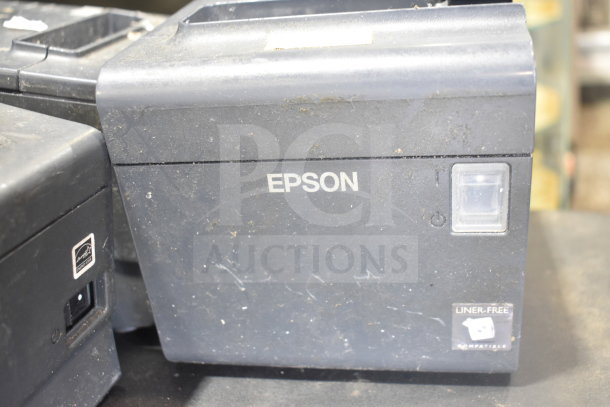 7-piece auction set: 4 cash drawers and 3 Epson receipt printers, shows wear, includes "Liner-Free" sticker.