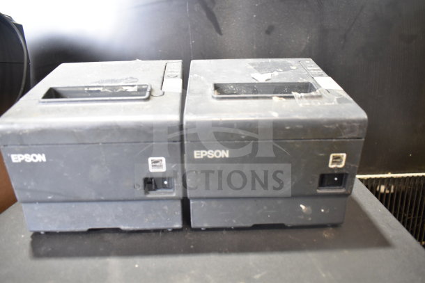 7 items including 4 cash drawers and 3 Epson receipt printers, used condition, visible Epson logos, sold 7 times your bid.