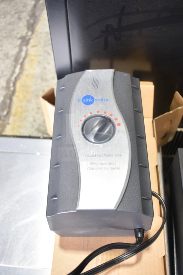 Insinkerator instant hot water tank, black and silver, dial control, visible logo, in good condition.