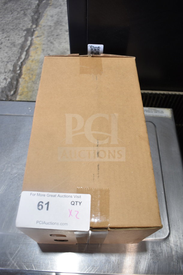 Brown cardboard box labeled "61 QTY x 2" containing 2 Insinkerator Hot Water Heaters, unopened, auction item.