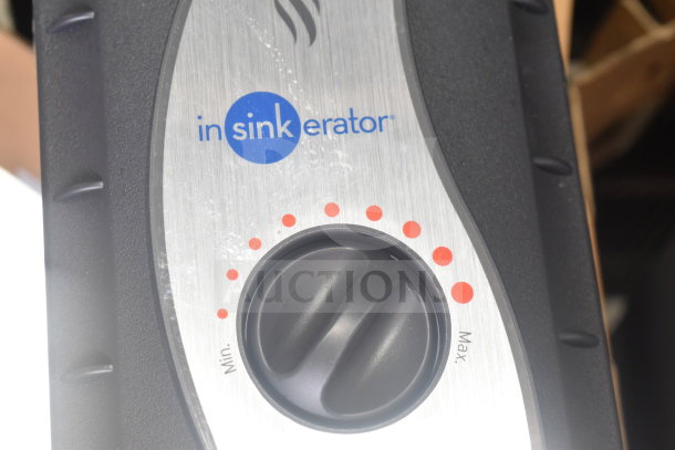 2 Insinkerator hot water heaters, featuring temperature control dial with Min and Max settings, brand logo visible.