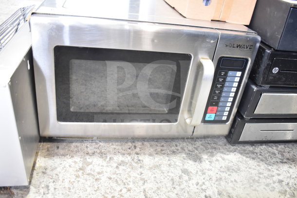 Solwave Commercial Countertop Microwave Oven, stainless steel, keypad controls, visible wear, ideal for restaurant use.