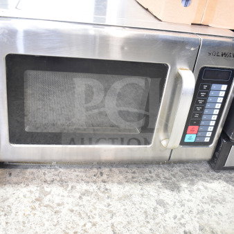 Solwave Commercial Countertop Microwave Oven, stainless steel, keypad controls, visible wear, ideal for restaurant use.