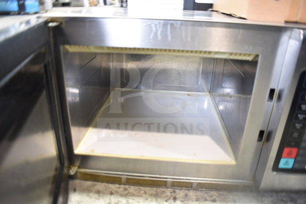 Solwave Commercial Countertop Microwave Oven, stainless steel, visible interior, showing minor wear, digital controls.