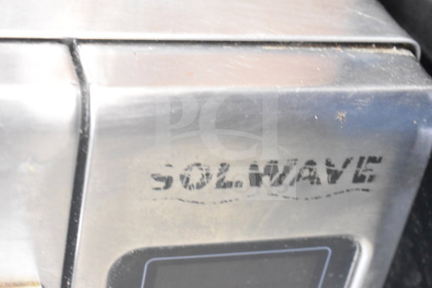 Solwave Commercial Countertop Microwave Oven; visible brand logo; stainless steel; used condition; ideal for businesses.