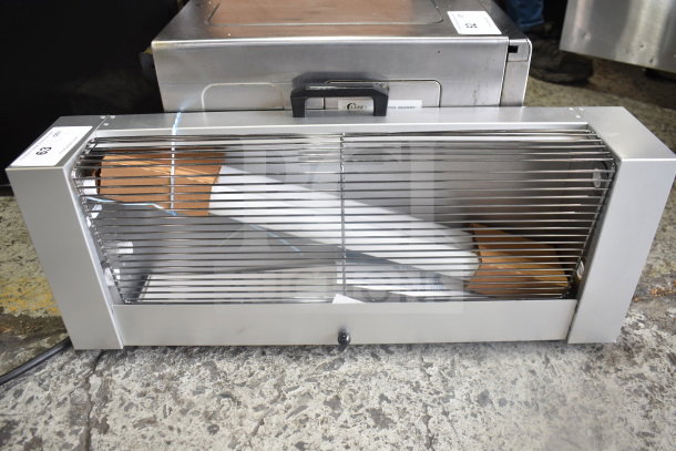 219GT Bug Zapper, model 219GT, 120 volts, 1 phase. Features a protective grill and compact design. Appears in good condition.