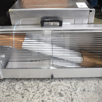219GT Bug Zapper, model 219GT, 120 volts, 1 phase. Features a protective grill and compact design. Appears in good condition.