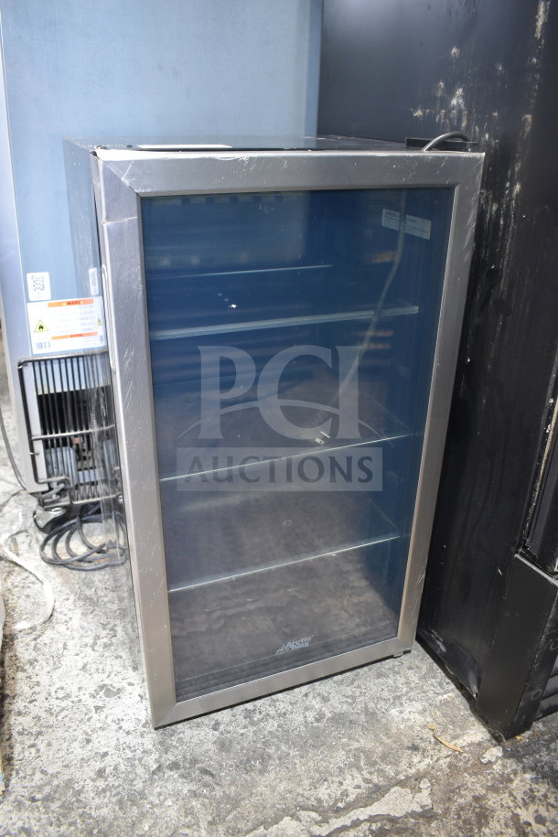 Arctic King ARV115B1AST mini cooler merchandiser, 115 volts, 1 phase. Stainless steel frame, glass front, multiple shelves, gently used.