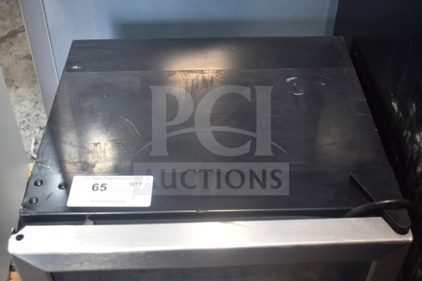 Arctic King ARV115B1AST mini cooler merchandiser, 115 volts, top view showing minor surface scratches and auction label 65.