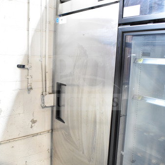 True Commercial Single Door Reach In Freezer, stainless steel, 115 volts, 1 phase; shows signs of wear; True brand visible.