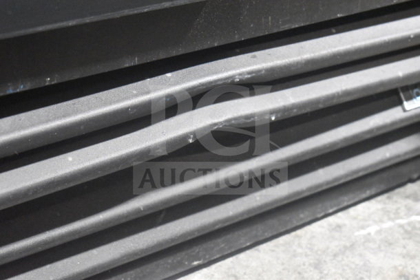 2019 True GDM-41SL-48-HC-LD cooler, grille detail shown, showcasing vent design; used, visible wear.