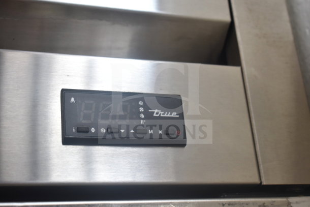2022 True T-19F-HC commercial freezer with digital control panel, brushed stainless finish, on casters. Model visible.