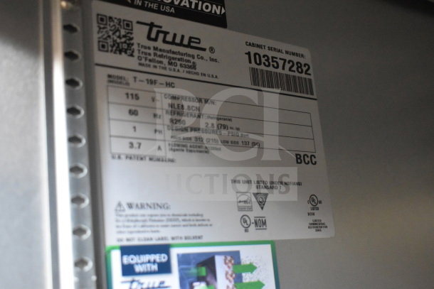 2022 True T-19F-HC commercial freezer label, showing specs: 115 volts, 1 phase, R290 refrigerant, NSF certified.