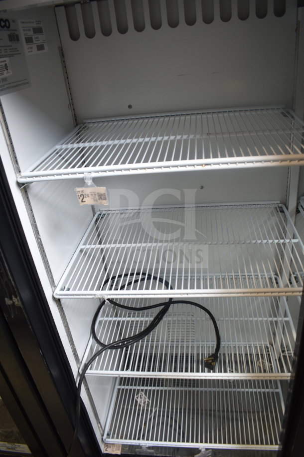 Habco ESM14SL60C commercial 2-door reach-in cooler, empty interior view, three wire shelves, power cord visible.