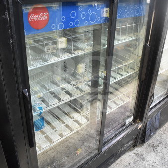 True GDM-41SL-60EM-LD Commercial 2-Door Reach-In Cooler Merchandiser, features sliding glass doors, 115V, used condition.