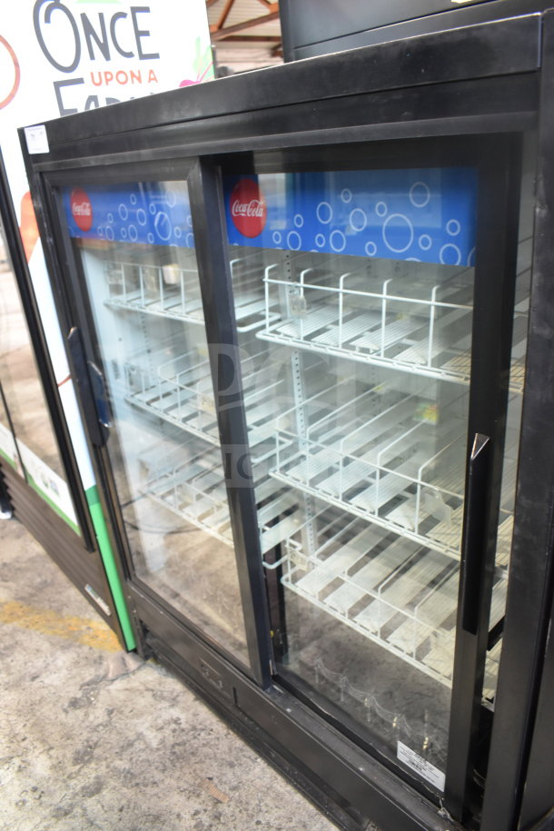 True GDM-41SL-60EM-LD commercial cooler, 2 glass sliding doors, Coca-Cola branding, shelves inside, 115 volts, 1 phase.