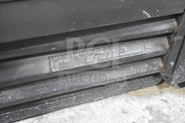 True GDM-41SL-60EM-LD cooler grate with logo, showing wear. 115 Volts, 1 Phase, commercial use.
