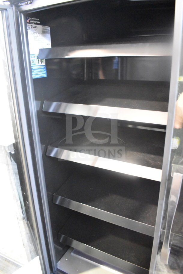 2026 True GDM-41SL-60EM-LD 2 Door Cooler Merchandiser, empty shelves, black interior, model label visible.