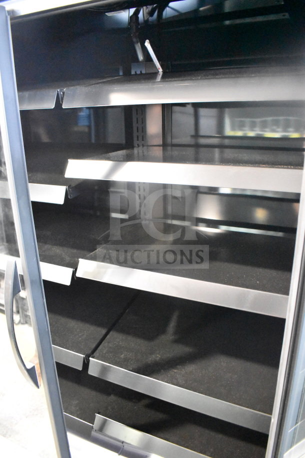 2026 True GDM-41SL-60EM-LD commercial cooler; two-door; multiple shelves; black interior; 115V, 1 phase.